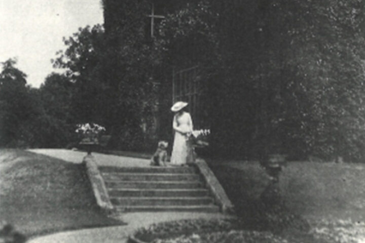 Ethel Bilbrough and Nat the Dog in the grounds of Elmstead Grange, c1907